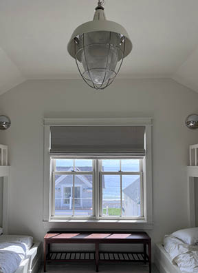 Custom bunk bed in the attic of a new construction beach home on Boston’s South Shore by a Boston interior designer.