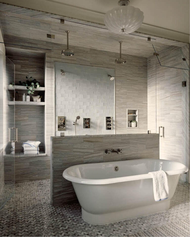 Brownstone renovation primary bathroom with a walk-in shower, freestanding tub, and luxury materials. Boston kitchen and bath design.