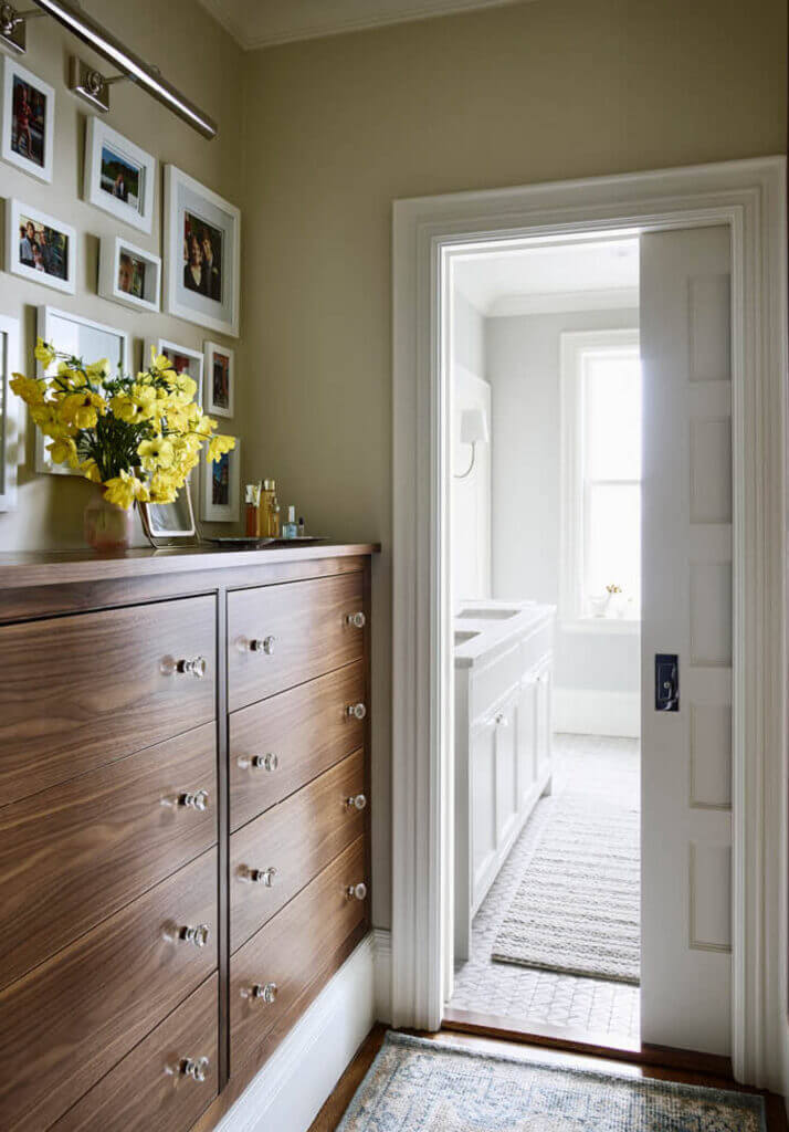 Custom walnut cabinets in a historic brownstone renovation, designed with expert space planning by a Boston interior designer.