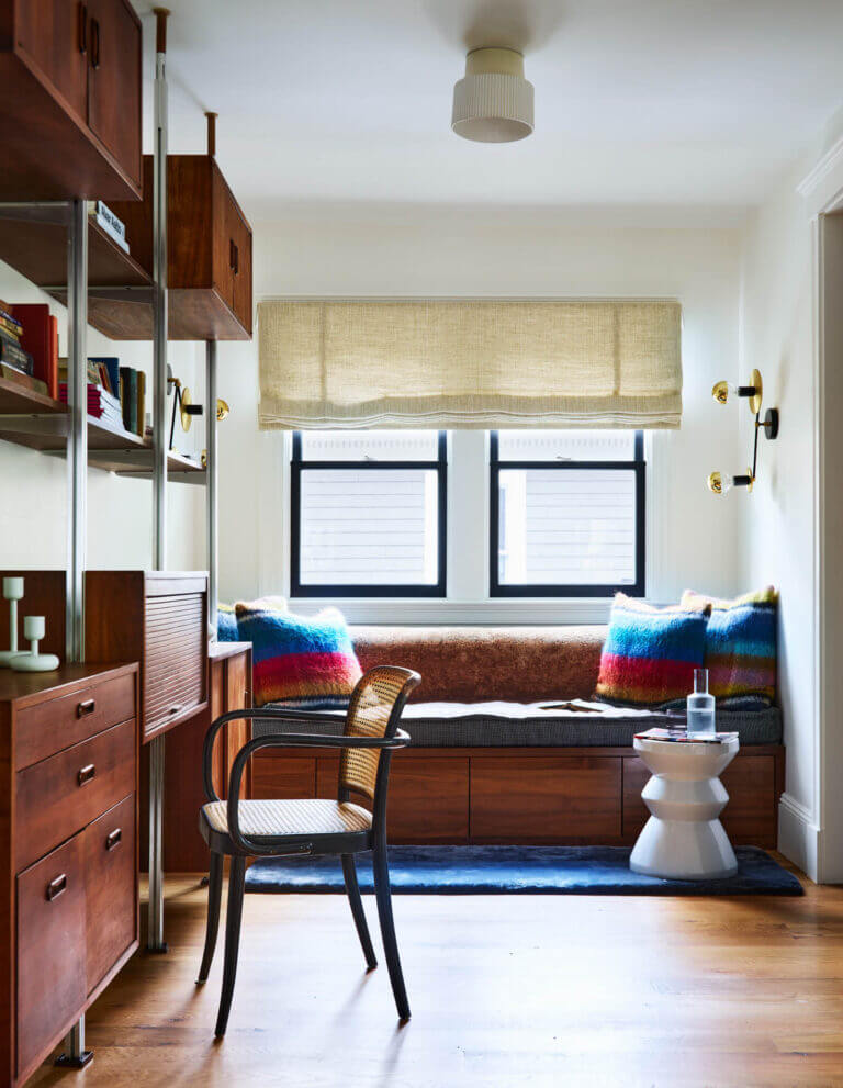 Custom interior design pairs a vintage heirloom desk with a walnut daybed, a Gastón y Daniela tufted mattress, and Pierre Frey alpaca pillows.