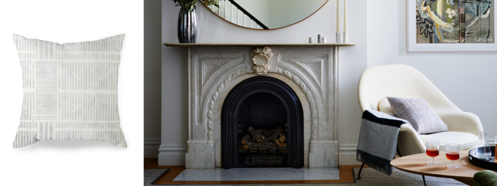 Original marble fireplace in a Boston brownstone styled by interior decorators in Boston with a womb chair and custom Theo pillow in Moonstone by Ellisha Alexina