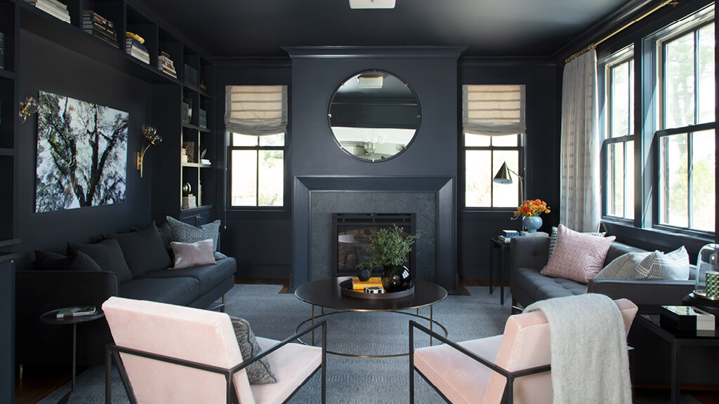 A Benjamin Moore Hale Navy living room with custom Roman shades, drapery, and simple decor in a full home furnishing guide project.