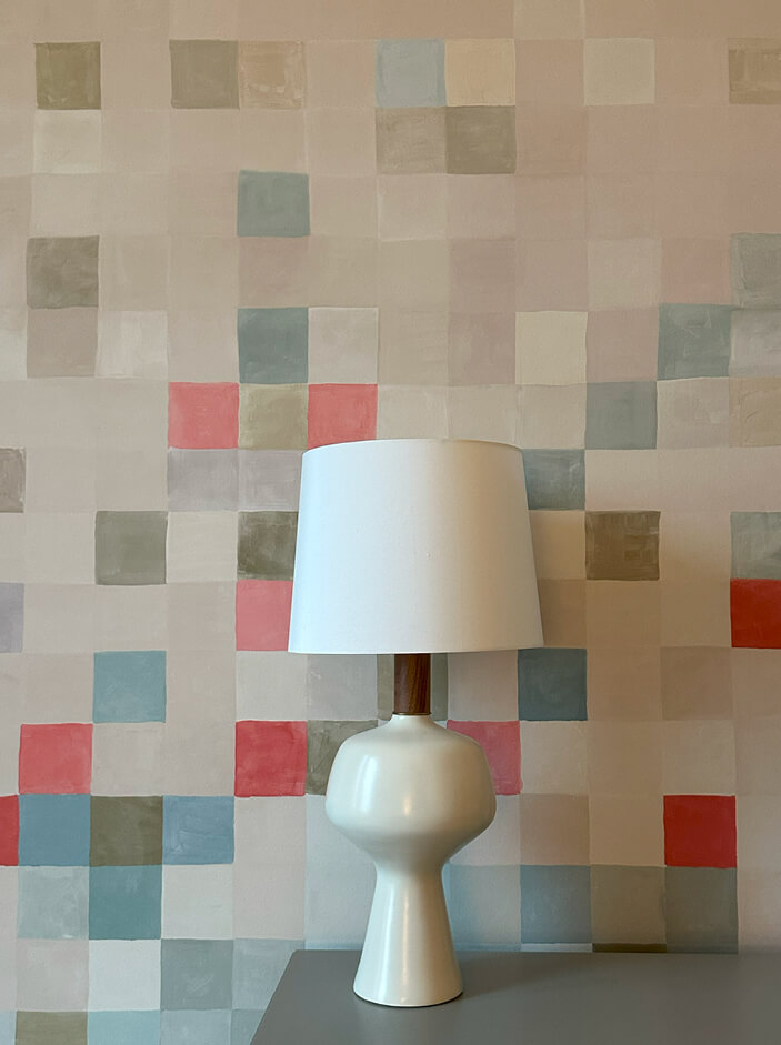 NYC Interior Design featuring a fun geometric Schumacher Madama de Pixel panel mural in pastel pinks, blues, and neutrals for a girls' bedroom.