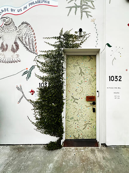 LA interior design showrooms include BDDW’s hand-painted exterior floral door at their Los Angeles building entrance