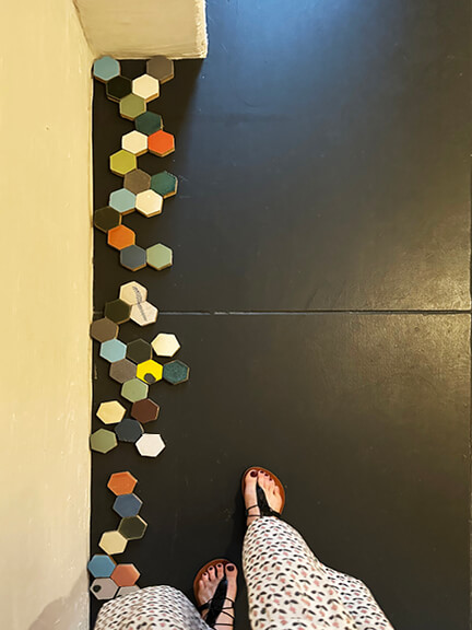 LA interior design showrooms feature BDDW’s custom ceramic tiles in hexagon shapes and bold colors on a black floor