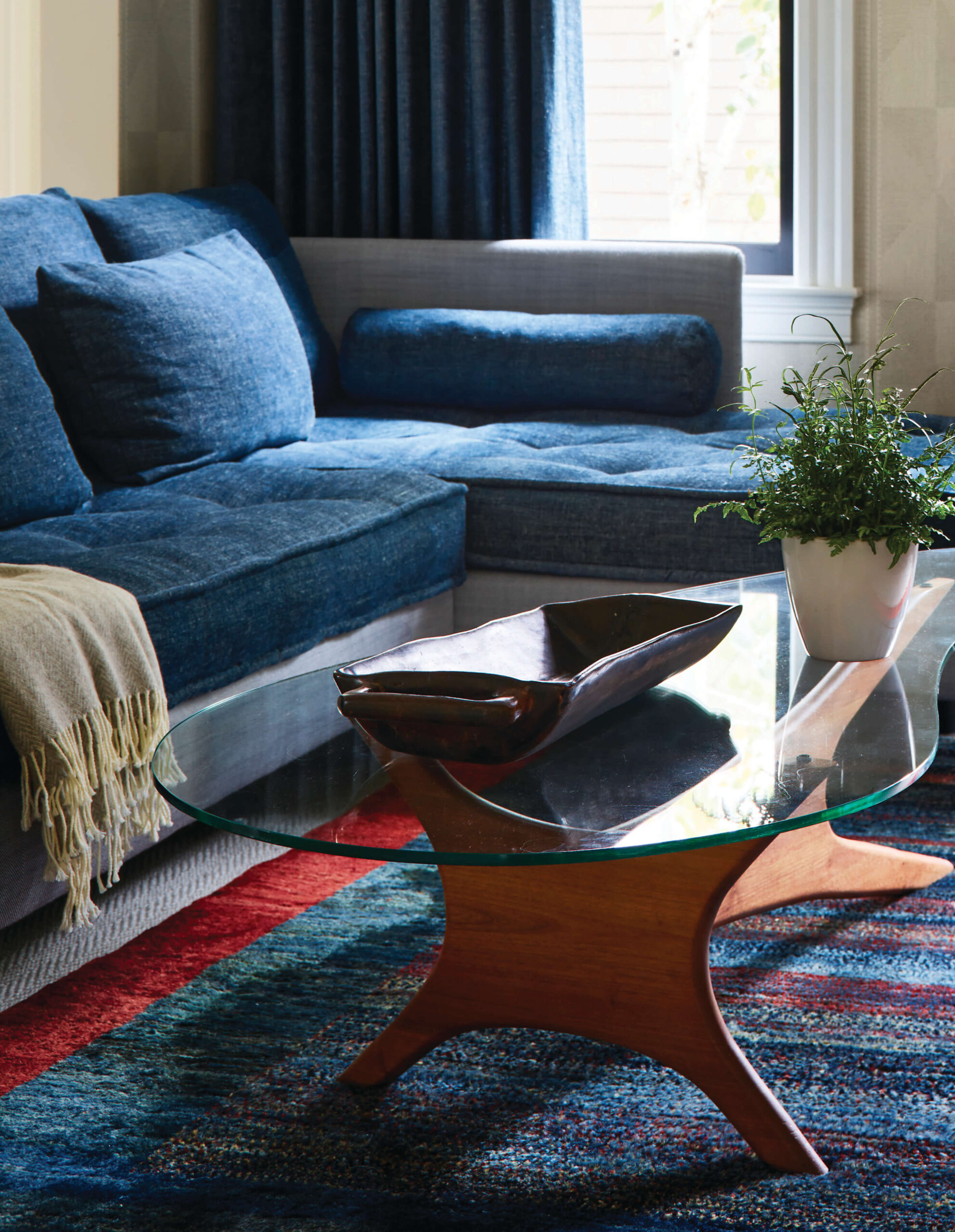 Open floor plan problems avoided with vintage furniture, antique rugs, and Pierre Frey wallpaper in a Brookline home.