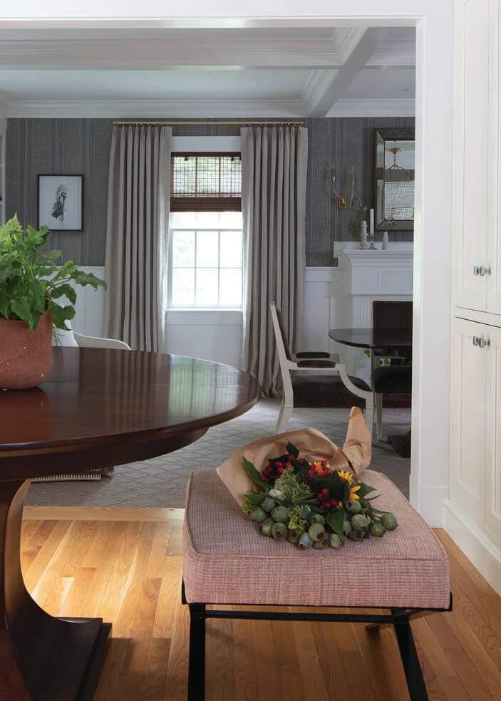 Hingham kitchen and dining room with traditional trim and custom finishes by Boston interior decorators.