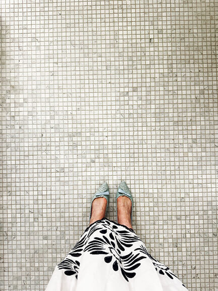 New England interior designer showcases Sacchetto ballet flats in blush pink leather on crisp grey patterned tile in a new construction home.