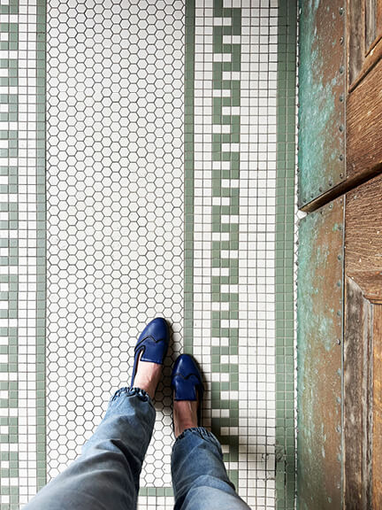 Boston-interior-designer highlights historic tile flooring at the Toronto Public Library with preserved early 20th-century detailing.