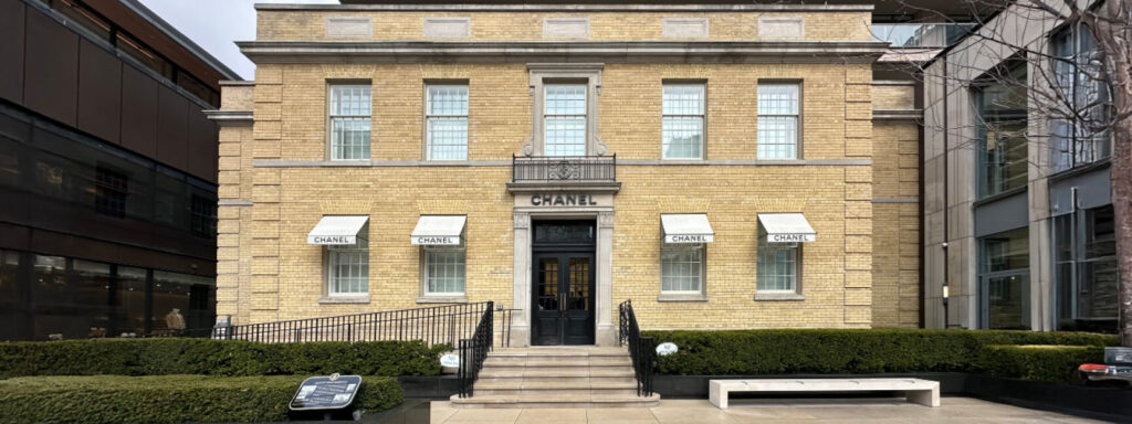 Restored yellow brick Chanel building in Toronto’s Yorkville shopping district, featuring classic architecture and design by Peter Marino