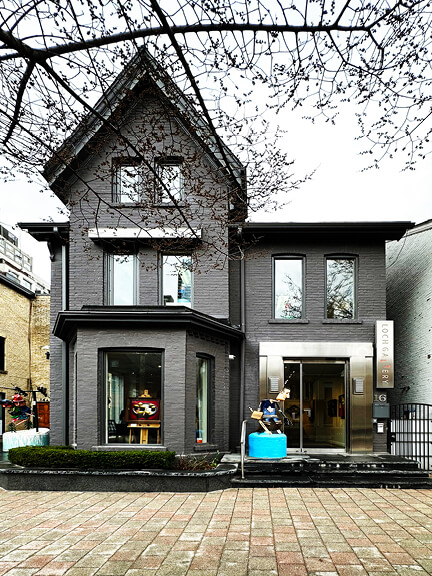 Charcoal storefront in Toronto’s Yorkville shopping district, blending historic architecture with modern retail design for galleries and shops