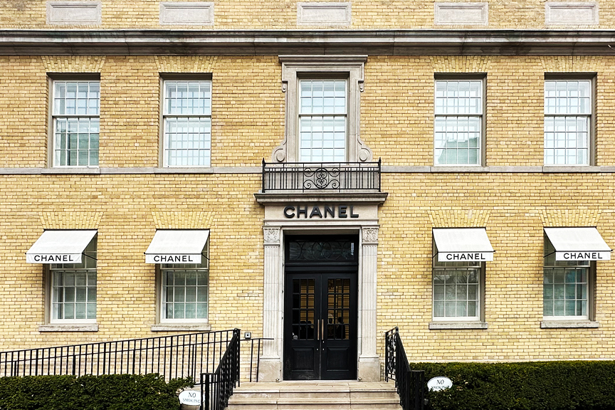 Chanel storefront in Toronto, a 1930s yellow brick building redesigned by Peter Marino for modern luxury retail.
