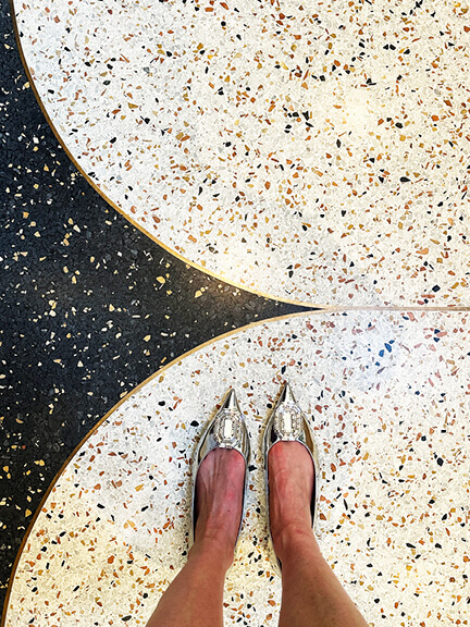 Historic-home-design-inspiration captured in terrazzo flooring with metallic accents at The Webster boutique in Toronto.