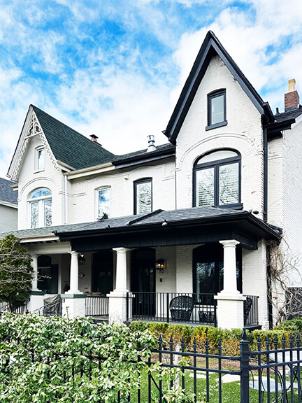 Historic-homes-in-toronto captured in a freshly painted semi-detached brick home with black accents in Summerhill.