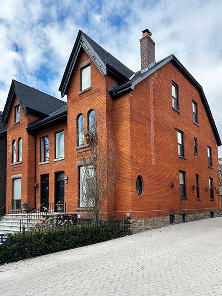 New-england-interior-designer captures a brick semi-detached home in Summerhill Toronto with classic proportions and historic charm.