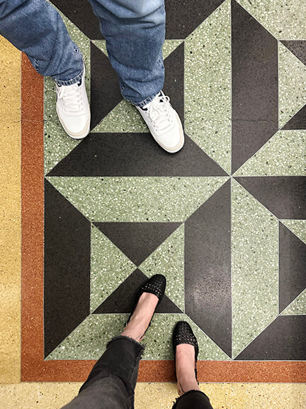 Historic-home-design-inspiration shown in colorful terrazzo floor with green, red, and yellow in a Toronto restaurant.