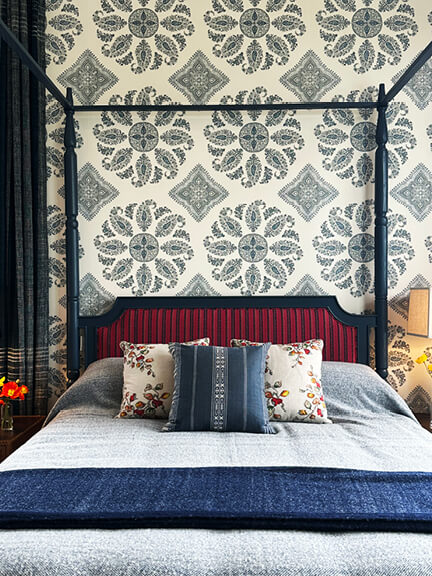 LA interior design showrooms feature a Peter Dunham canopy bed with blue and white wallpaper at Hollywood at Home in Los Angeles