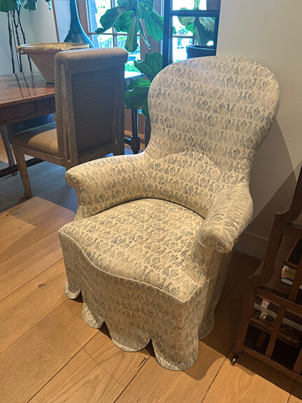 LA interior design showrooms feature a scalloped skirted wing chair in light blue patterned fabric at Rose Tarlow's LA showroom