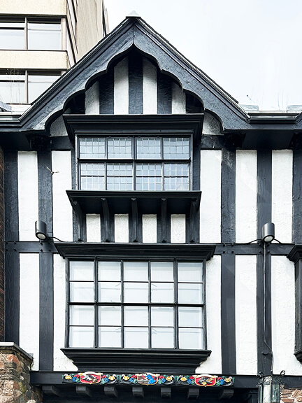 Historic-home-design-inspiration shown in Tudor revival details and half-timbering on a classic Toronto building.