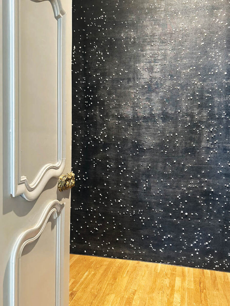 Constellation rug with white-dotted night sky design in LA interior design showrooms at Christopher Farr