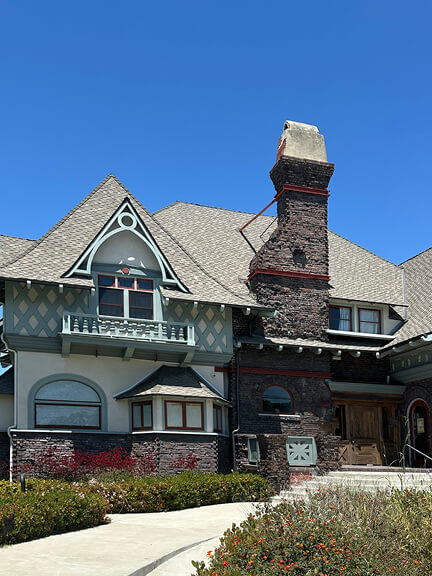 Historic Colonial Revival Fitzgerald House in West Adams, Los Angeles, featuring variegated brick and detailed millwork.