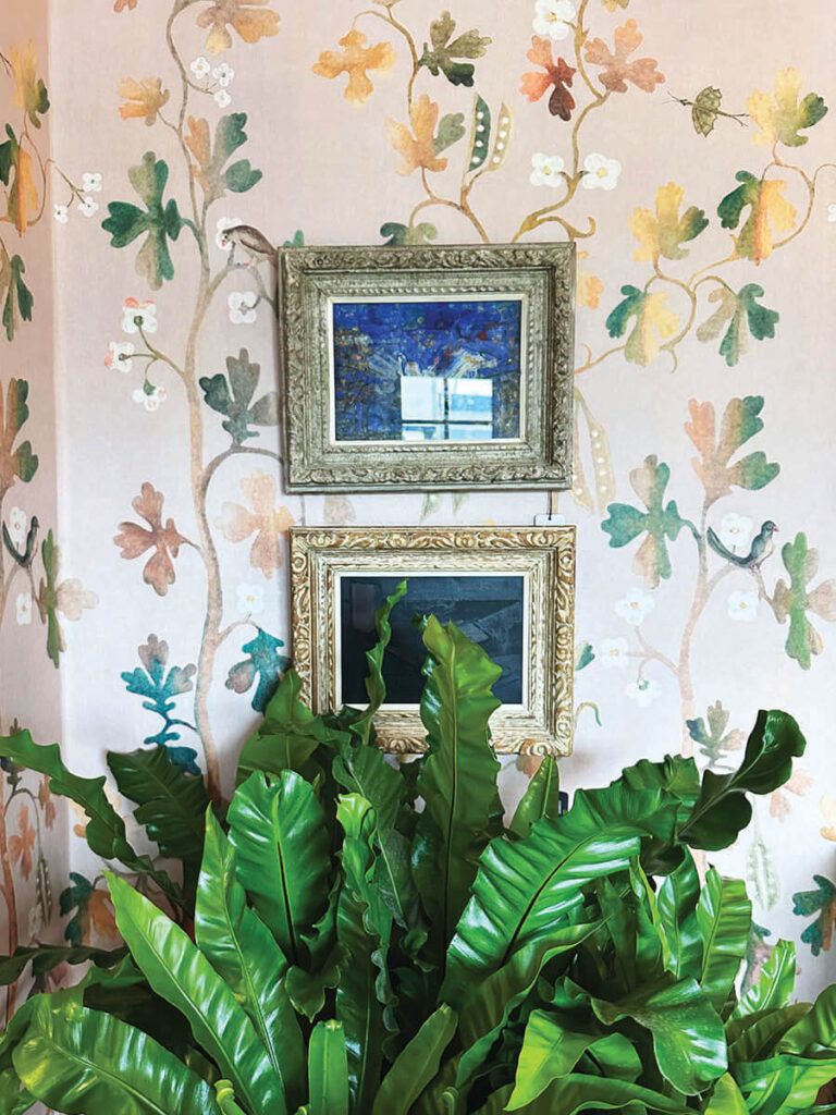 Floral wallpaper and vintage art with lively plant in LA interior design showrooms at Harbinger.