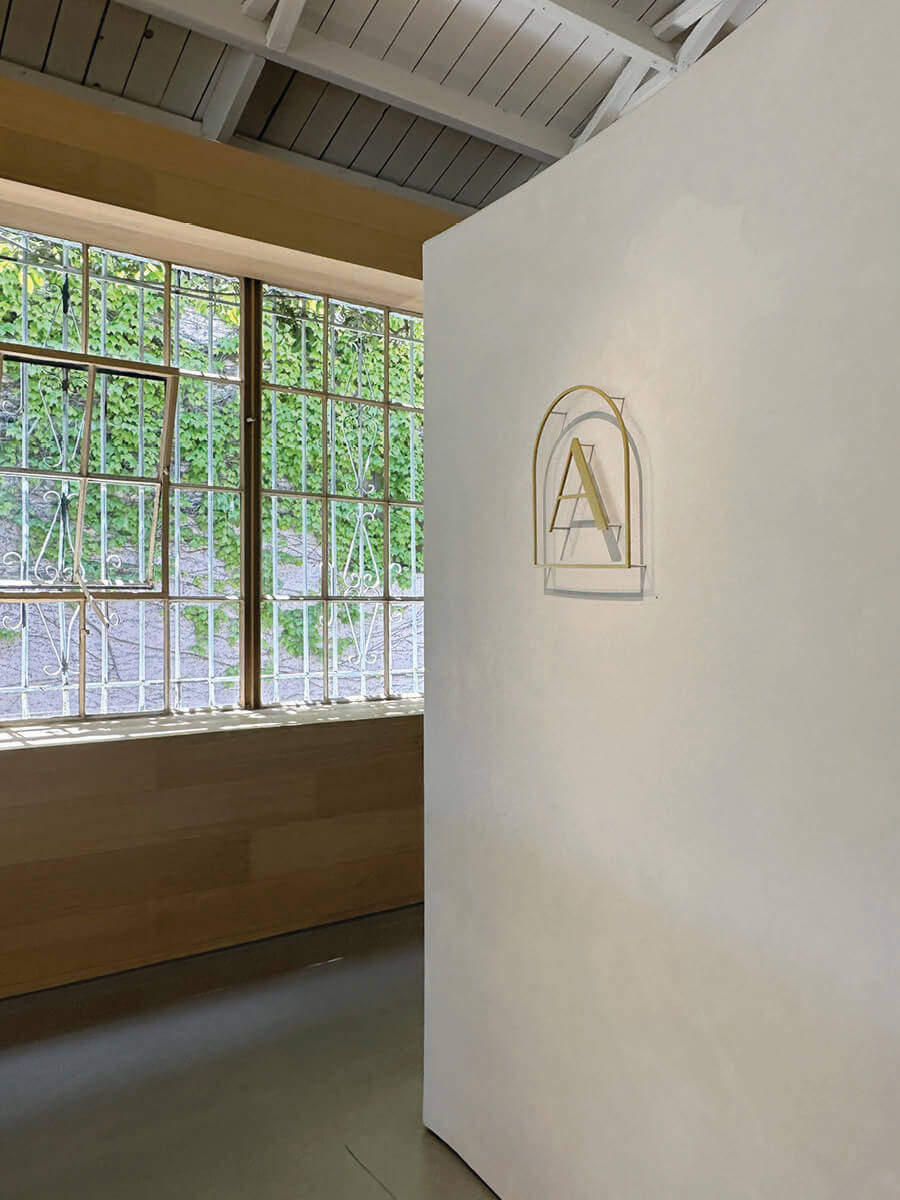Antique windows and pristine plaster walls in LA interior design showrooms at Armadillo.